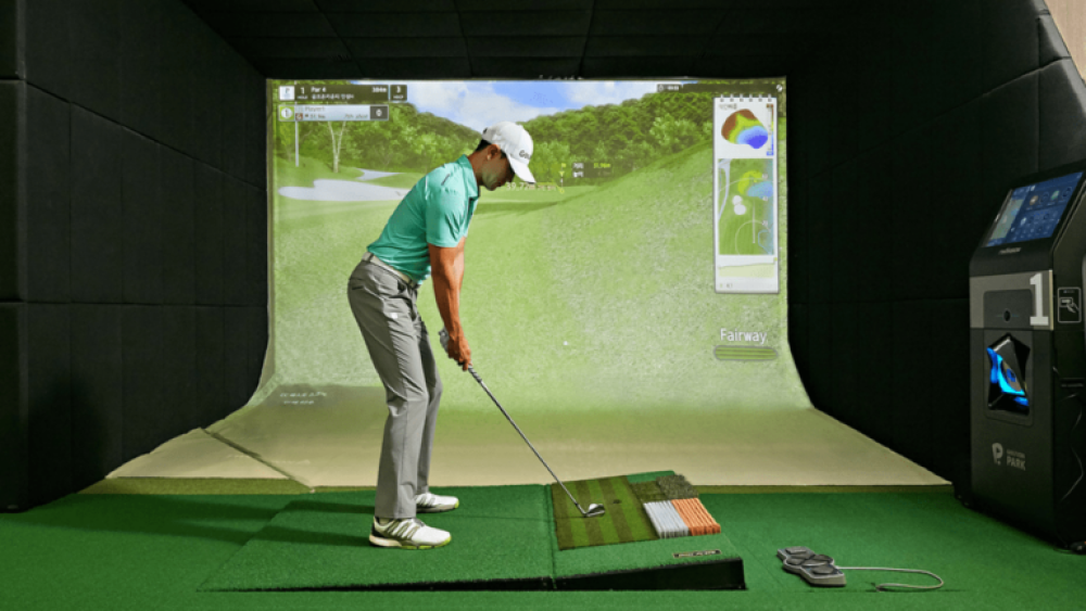 Male Golfer Standing on Moving Swing Plate Golfzon Golf Simulator TwoVision