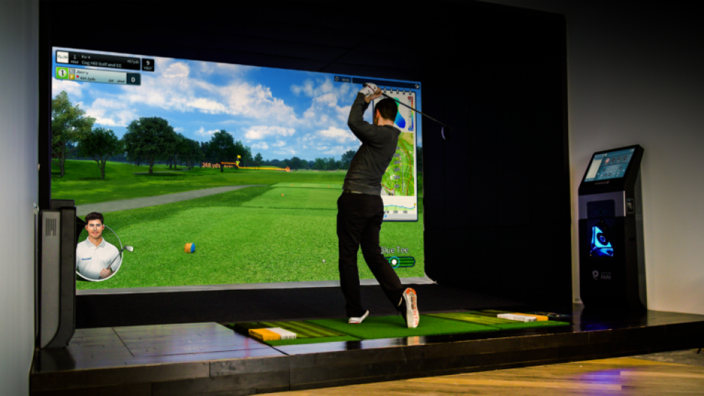 Male Golfer Post Swing on TwoVision with Virtual Caddie on Screen