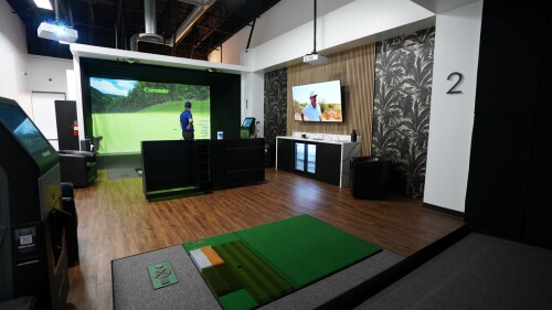 Golfer in Background at TwoVision Bay at Golf Envy in Los Angeles