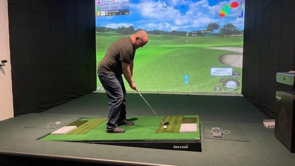 Golfer Prepping Swing on Swing Plate Golfzon Golf Simulator Albatross