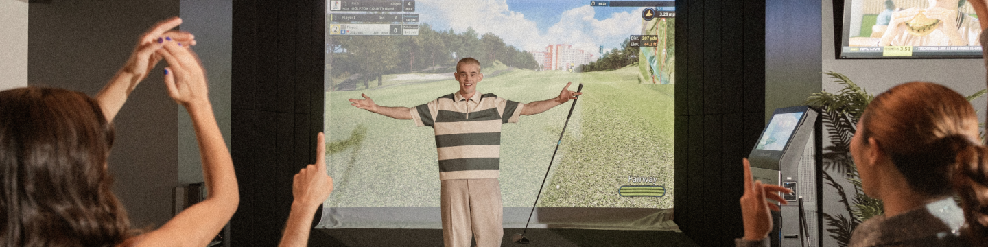 Golfer cheering to crowd on a simulator