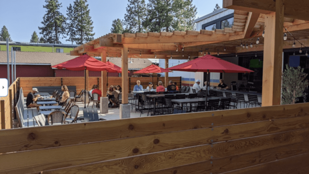 Outdoor Venue Tables, Umbrellas, Chairs, People