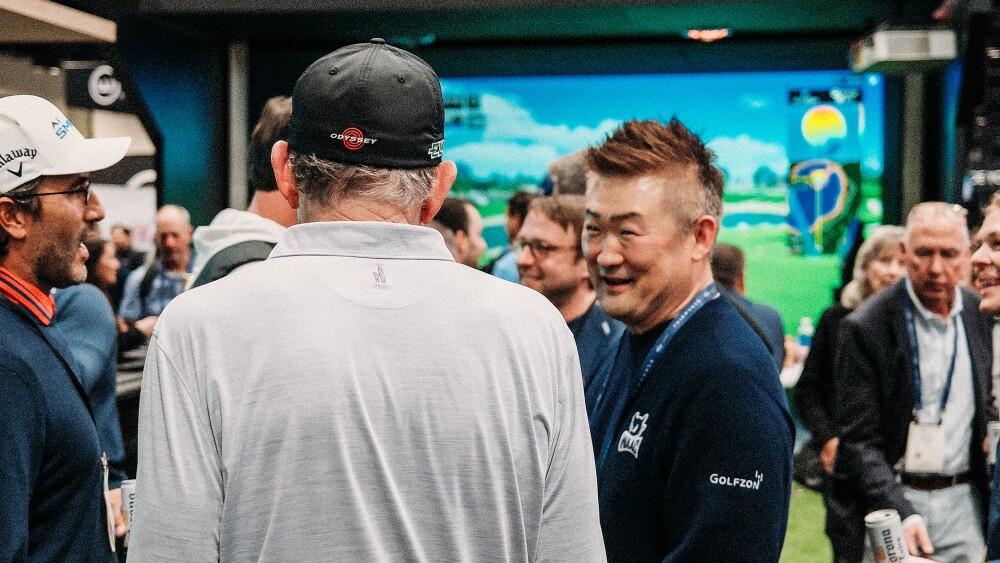 CEO of GOLFZON America, Sean Pyun, talking to David Leadbetter at the PGA Show in 2025