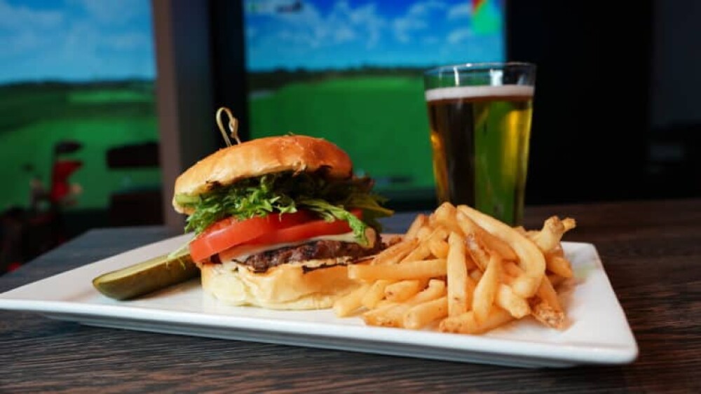 Burger, Fries, Beer in Glass, Pickle - In Front of Golfzon Golf Simulator