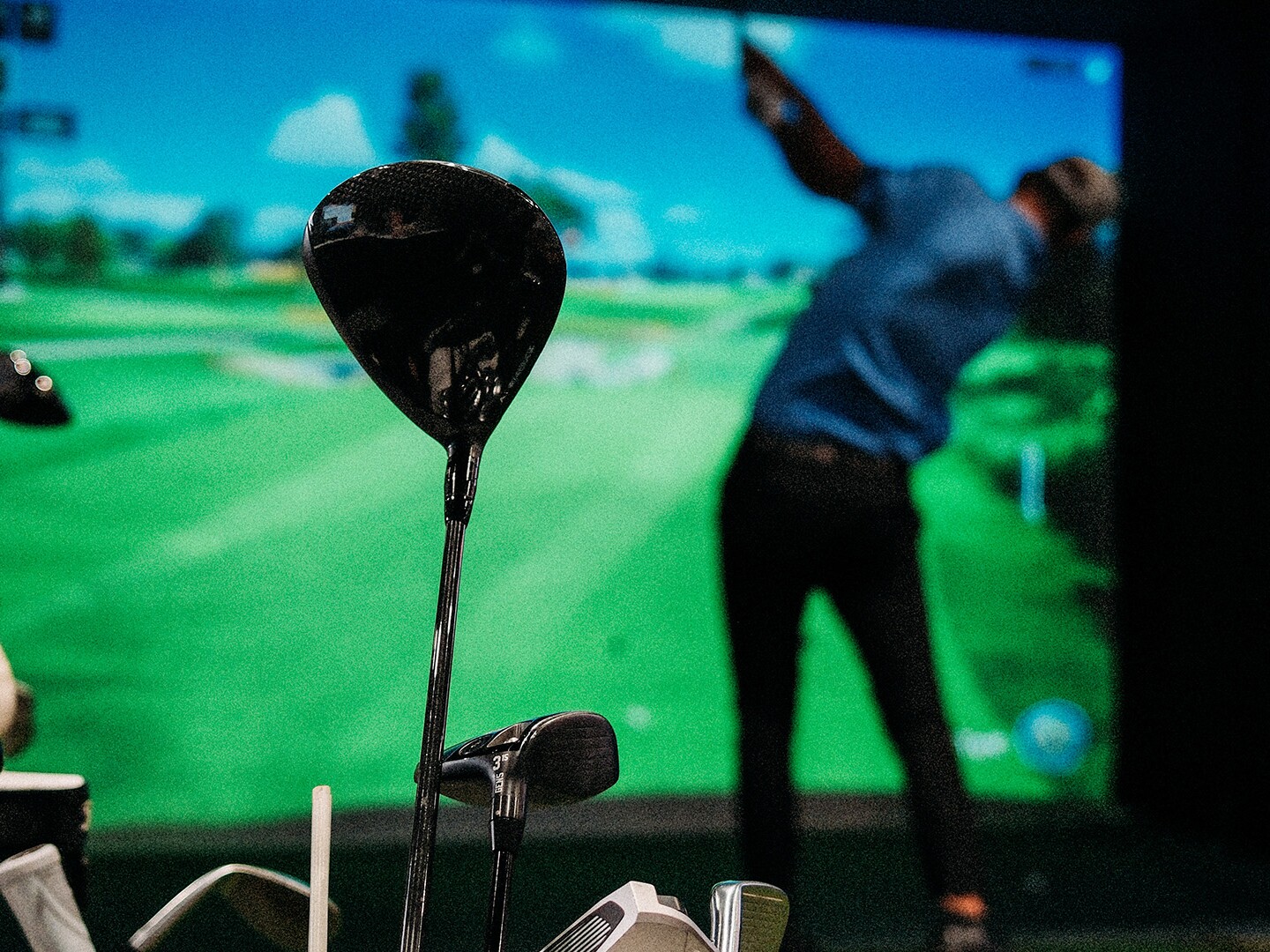 Driver in focus with Detroit Player Swinging in the Background