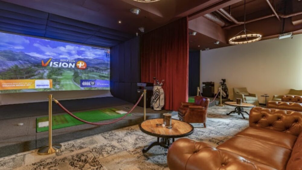 Hook and Fade, Rope Behind Golfzon Golf Simulator, Couches and Tables on Carpet