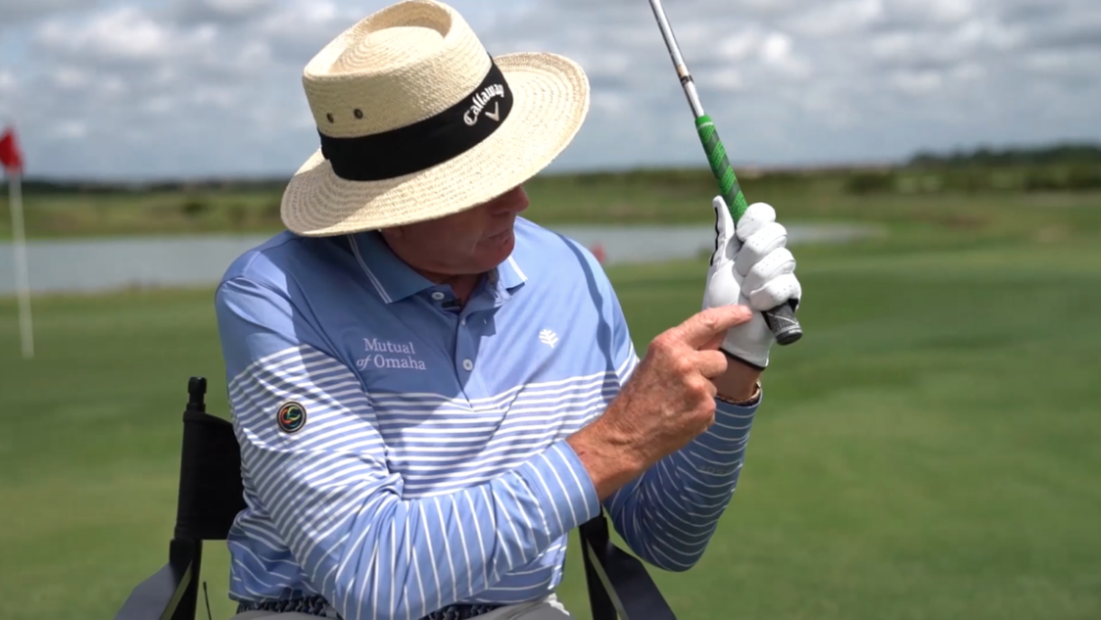 leadbetter pointing to club held in gloved hand