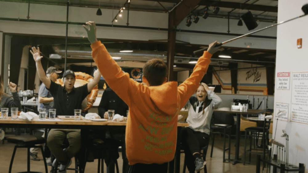 Group of Golfers Celebrating After Good Shot, Walt Reillys Celebration Event Group