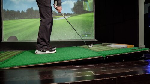 Golfer Standing on Moving Swing Plate with Wedge