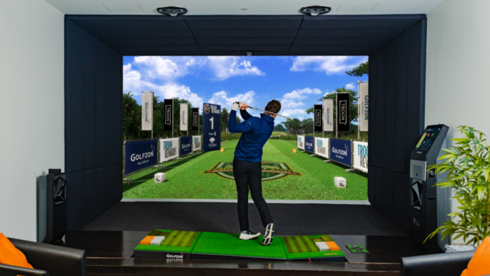 Directly Behind Golfer Playing on Moving Swing Plate on Golfzon Golf Simulator TwoVision