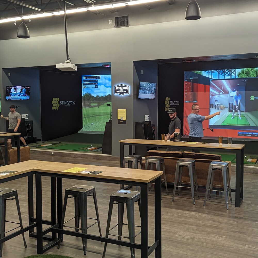 Stinger's Golf Club TwoVision Simulators with People, Tables