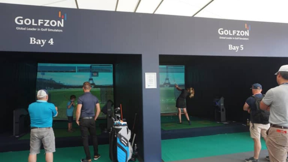 Golfers at Bay 4 & 5 Golfzon Simulators - The 147th Open's R&A Swingzone