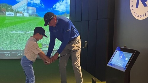 child kid junior golfer learning how to golf hold golf club with david leadbetter