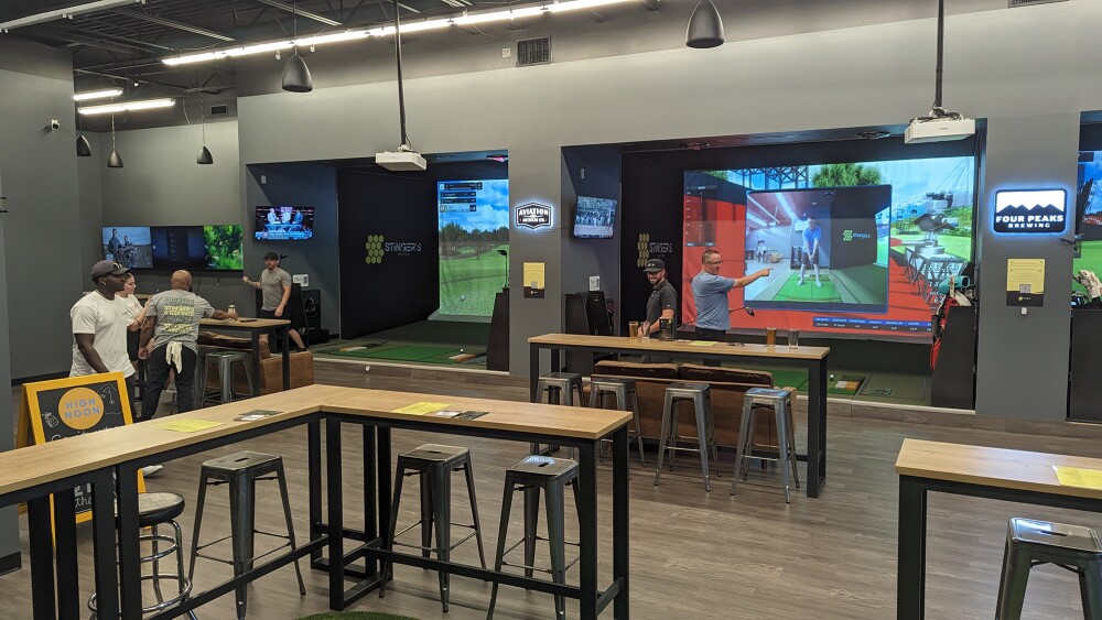 Stinger's Golf Club TwoVision Simulators with People, Tables