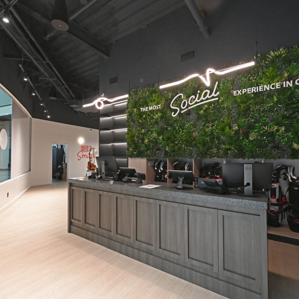 The Most Social Experience in Golf with LED Lights on Grass Wall at Entrance Check In at Golfzon Social Palisades Center West Nyack NY