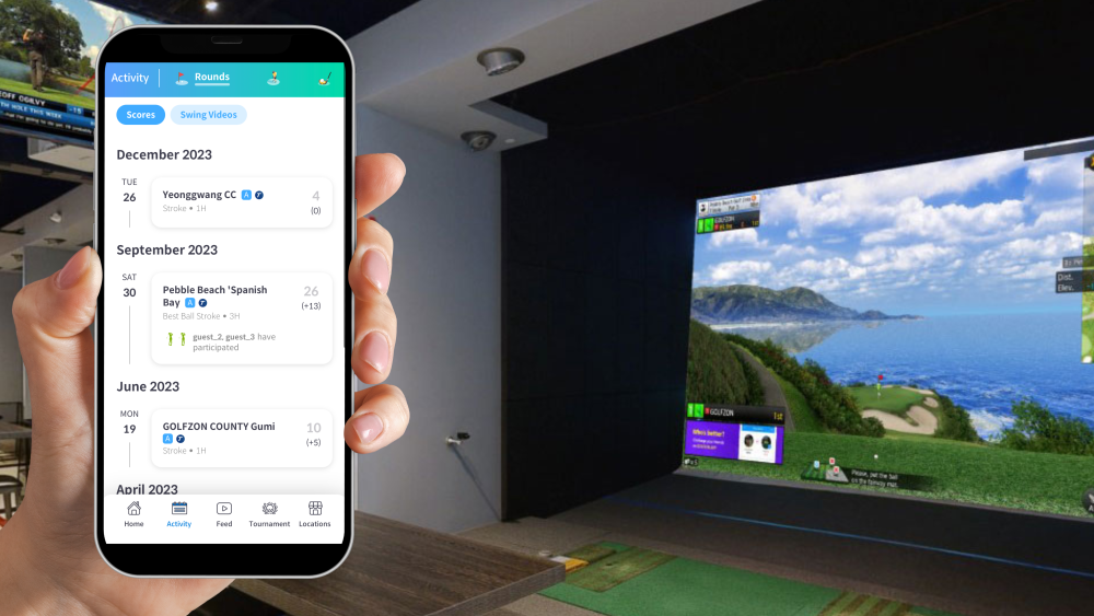 Golfzon Global App Shown on Phone, Person Holding Phone in Front of Golfzon TwoVision Simulator