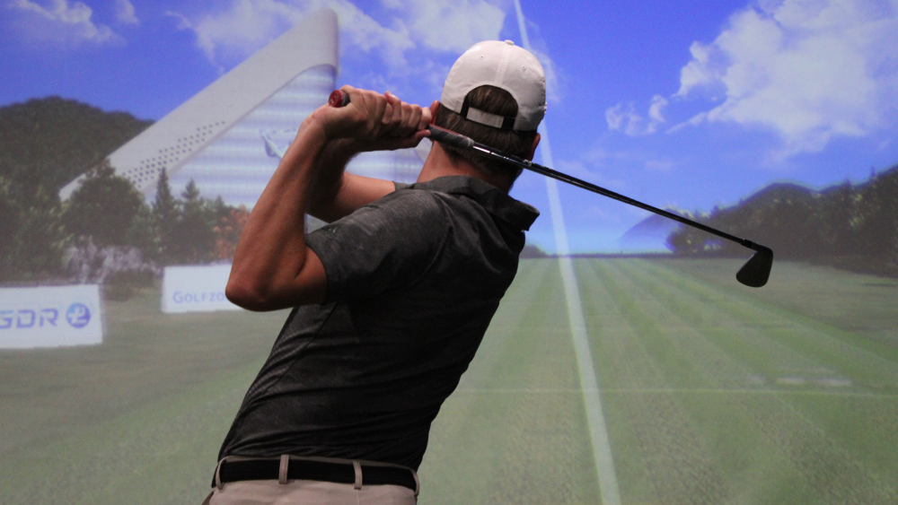 Golfer Watching Shot on Golfzon Range GDR