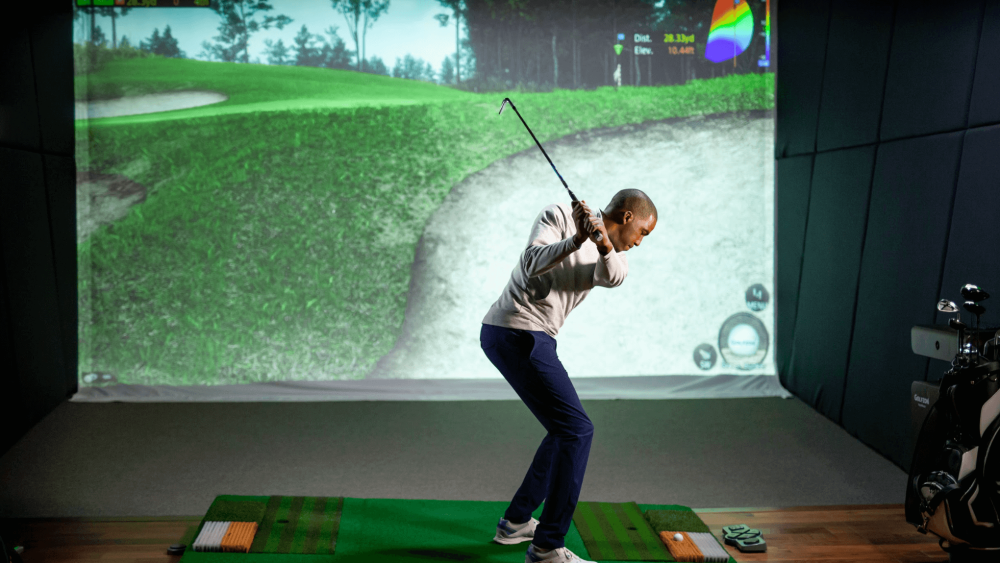 Male Golfer Swinging on Twovision Simulator